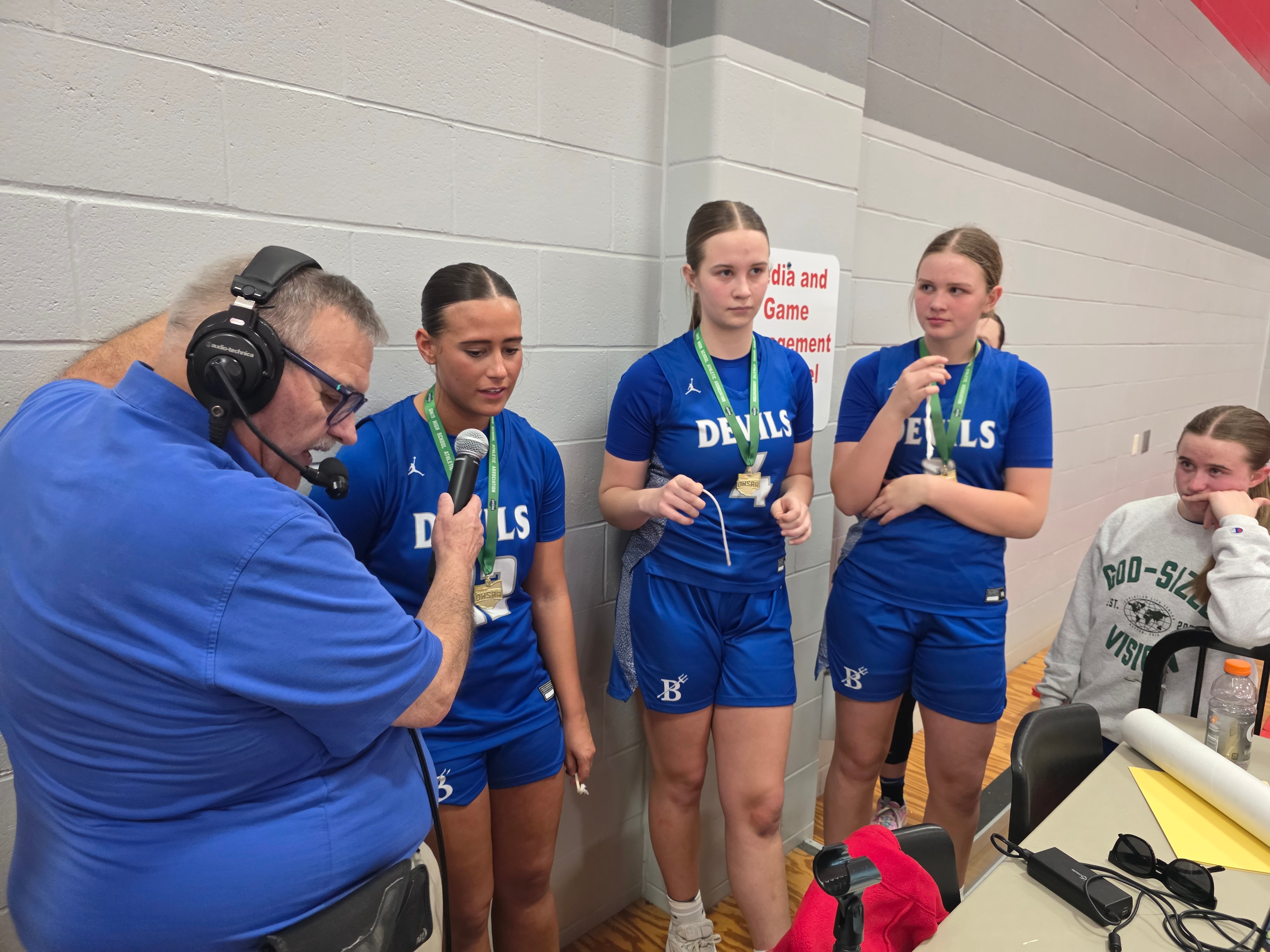 Bill interviewing Brookville Lady Devils after winning the District Basketball Championship, 2026.
