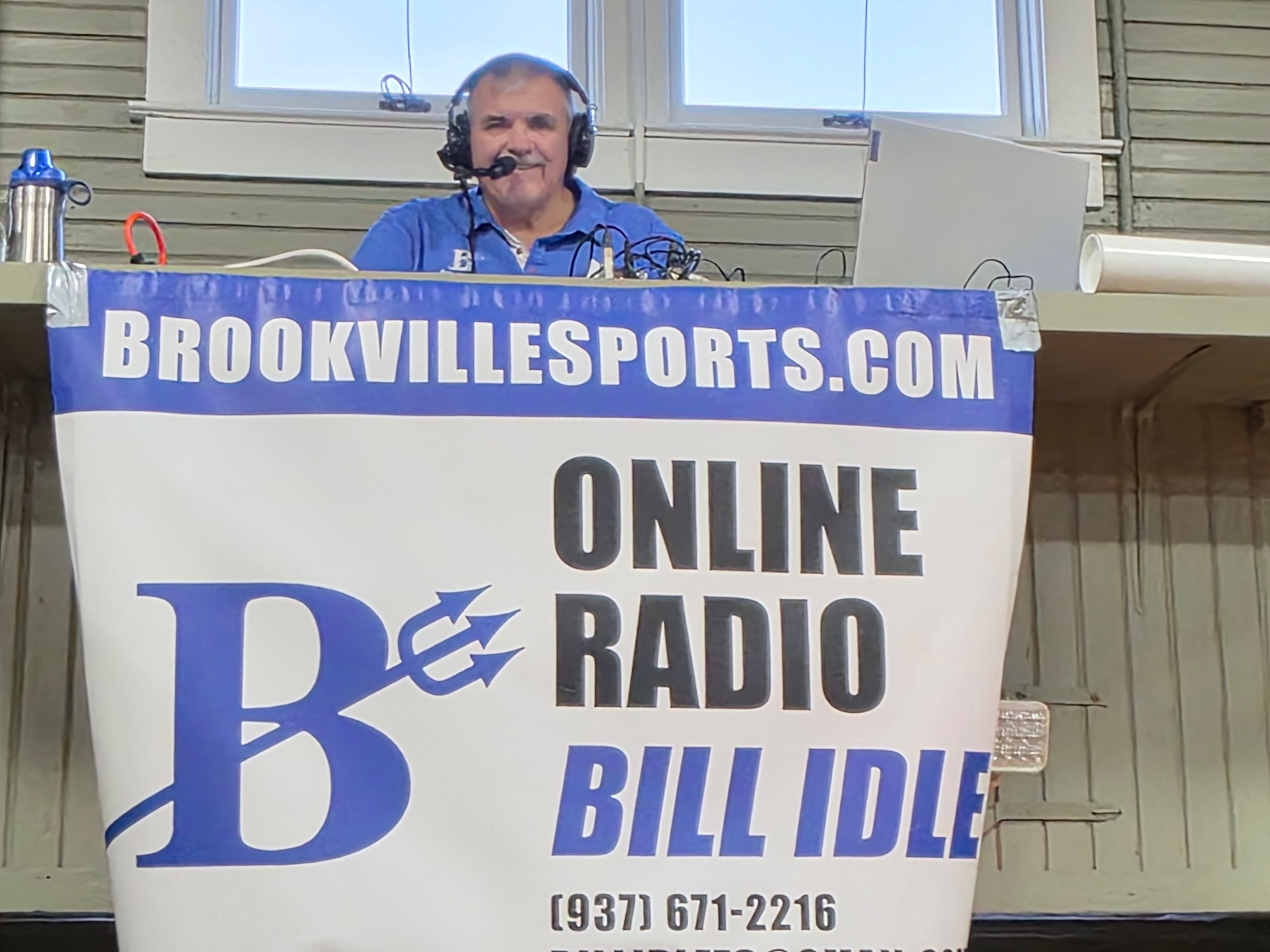 Group at Brookville High School gymnasium bleachers
